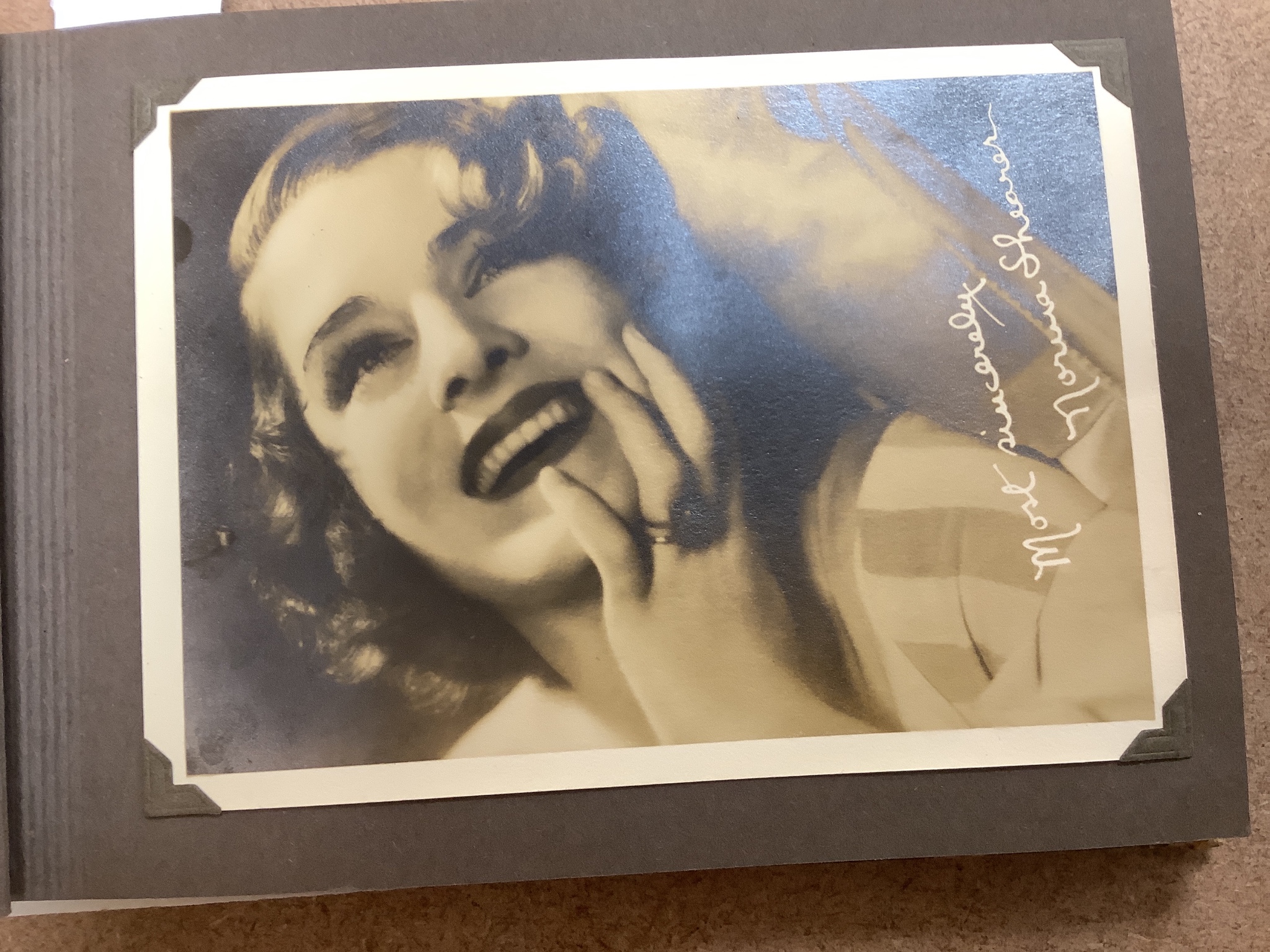 An album of 1930s monochrome postcards including film stars, some signed, letter and other signatures